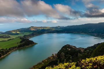 Fototapeta na wymiar Beautiful landscape with volcanic lake and forest surrounding in Furnas Azores, Portugal