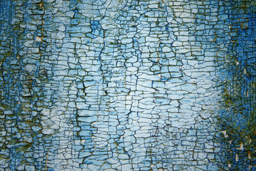 Old painted turquoise wooden board with peeling paint texture and pattern background for design and text