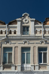 Urban landscape with an old building against a blue sky.