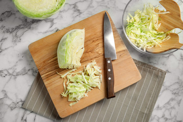 Flat lay composition with cut cabbage on table