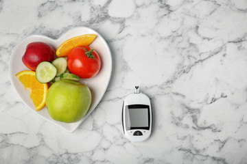 Flat lay composition with digital glucometer, fruits and vegetables on table. Diabetes concept