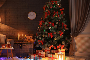 Stylish room interior with decorated Christmas tree