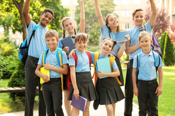 Fototapeta premium Group of children in stylish school uniform outdoors