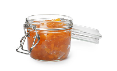 Jar with peach jam on white background