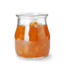 Jar with peach jam on white background