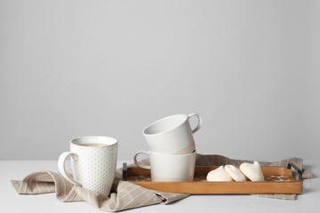 Fototapeta na wymiar Ceramic tea set and tasty meringues on table