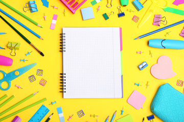 Flat lay composition with different school stationery on color background
