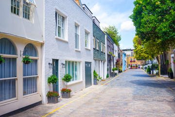 Exclusive mews with colored luxury residential houses in Marylebone, a weatlhy borough of central...