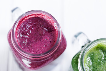  Freshly prepared organic smoothie in retro glass bottles