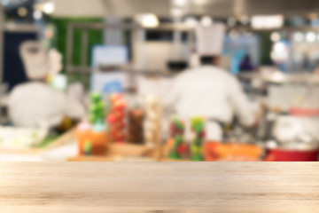 Empty wooden Table with blurred Chef