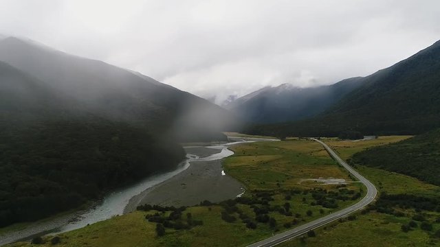 Landscape of the river and the road in the valley of the mountains. Shevelev.