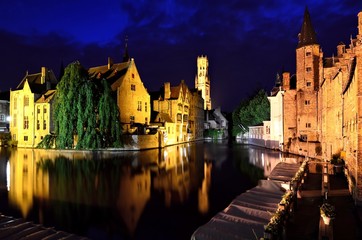 Evening view of the illuminated medieval canals of Bruges, Belgium