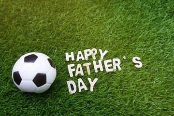 Happy Father's day to golfer on green grass with football
