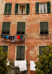 Fototapeta na wymiar Clothes drying in the window