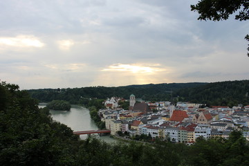Sun bursts through clouds over a German city
