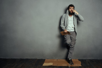 man stands against the wall style