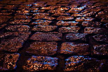 Abstract urban background of the streets after the rain, reflection of light on the wet asphalt. Neon lights, light effect.