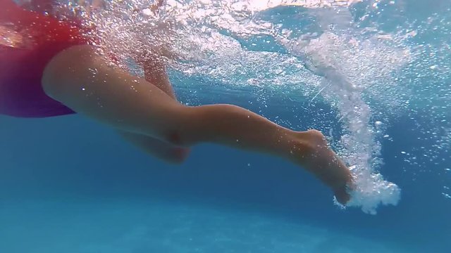 Underwater Little Girl Swimming in Swimming Pool Slow Motion