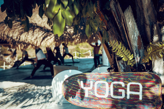 Wooden yoga sign