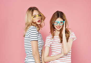 two young girls in glasses