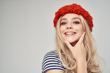 woman in a red hat smiling