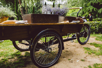Fototapeta na wymiar Old wooden cart to transport goods used for decoration at a wedding.