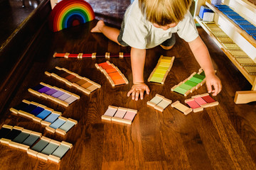 Children playing and learning with montessori color tablets