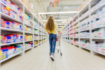 Portrait of a Woman Pushing a Shopping Cart in a Supermarket