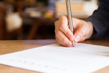 business man signing contract document