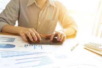 business people analyzing graph and chart document