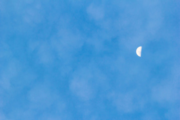 Bright sky background with half moon