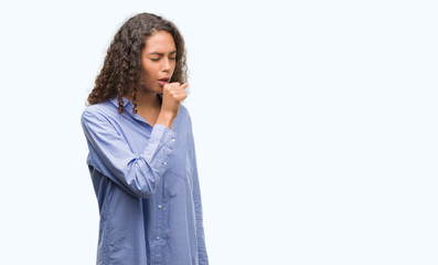 Young hispanic business woman feeling unwell and coughing as symptom for cold or bronchitis....