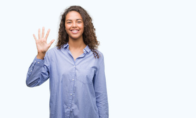 Young hispanic business woman showing and pointing up with fingers number five while smiling confident and happy.