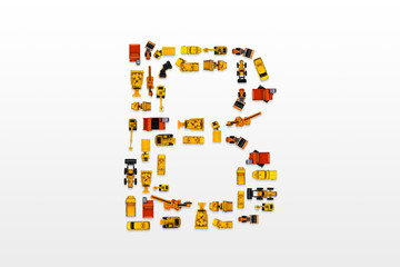 English letters formed by arrangement of Car toy diecast on the white background , Top view