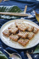 Homemade halva - sweet confections dessert made with tahini (sesame paste) nuts, butter, sunflower seeds, dates, honey, herbs, spices, oil. Vegan sweets. Vegetarian dessert. Arabic Turkish halava