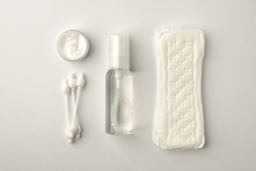Different personal hygiene objects on white background, female boycare concept, monochrome, top view