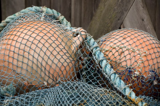 Heap of colorful buoys and fishnet  - 1