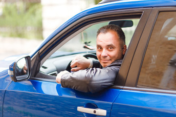 Middle-aged man driving a car