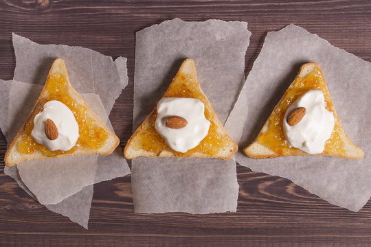 Toast with bread, nuts, jam and yogut