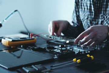 computer upgrade. technology development. microelectronics scientific innovation concept. engineer disassembling laptop