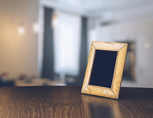 old photo frame on the wooden table