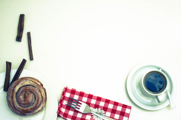Cake, cinnamon, coffee, napkin , white background.