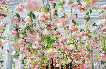 Wedding ceremony decoration with many artificial flower hanging from ceiling. Beautiful Upside down...