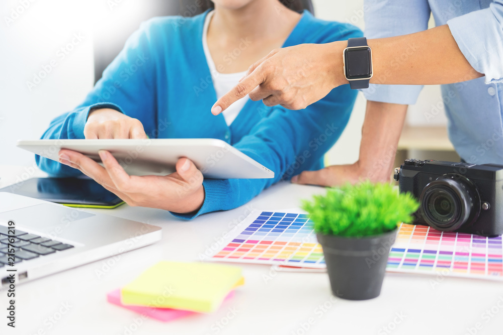 Poster creative or designer teamwork with pantone swatch and building plans on office desk, architects choo