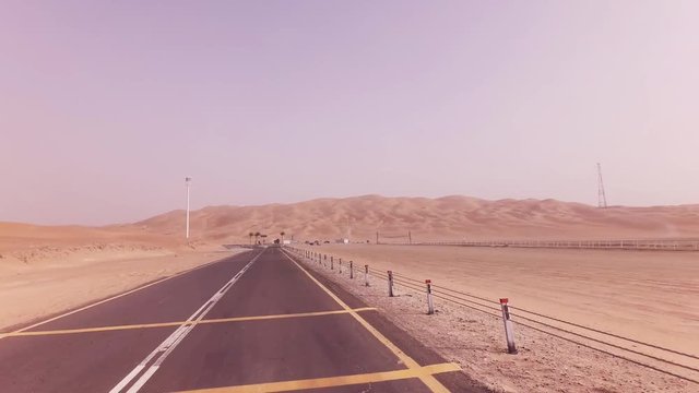 New road from Oasis Liwa to Moreeb Dune in Rub al Khali desert stock footage video