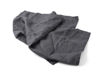 Side view on dark black linen napkin isolated on white background. Anthracite grey linen napkin. Isolated on white with clipping path.