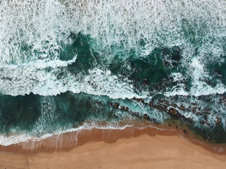 Aerial photo of waves on beach