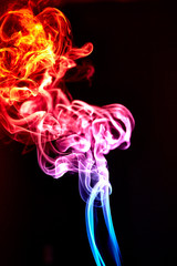 Obraz premium Colorful smoke on a black background