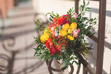 Bright unusual bridal elegant autumn bouquet on the wall background