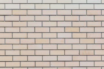 Yellow bricks in the wall as an abstract background